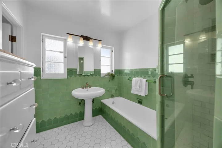 Original wall tile and towel bars along with a gorgeous built-in