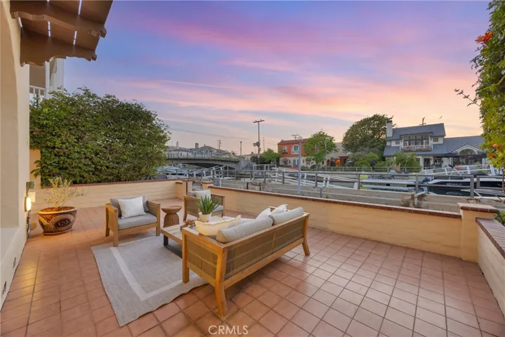 Large patio with canal and sunset views