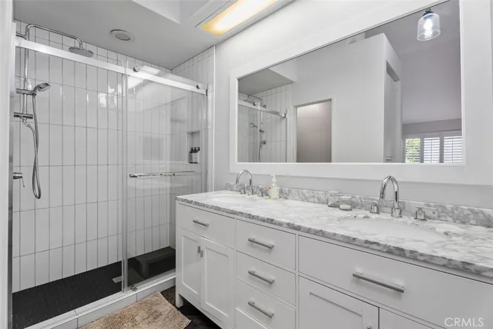Double vanity with marble counters in primary