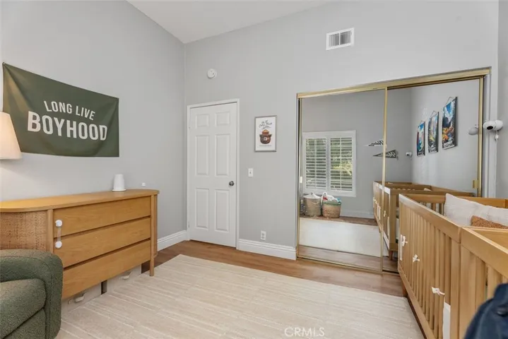 Mirrored closet doors in guest bedroom