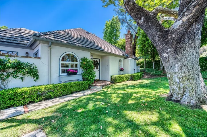 Beautiful mature vegetation surrounds the home