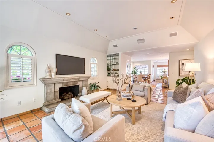 Living room with fireplace and dry bar
