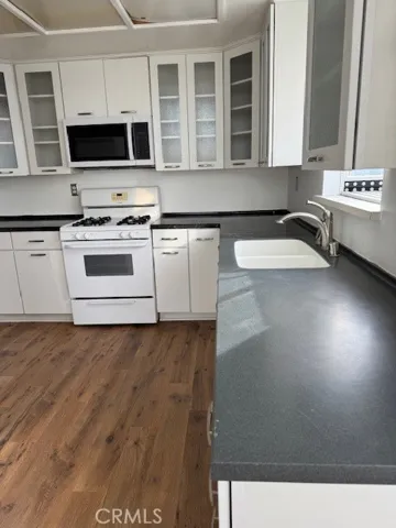 New Cabinets with Glass Door Fronts and Beautiful Counter Tops