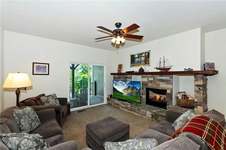 Second family room downstairs with a beautiful fireplace