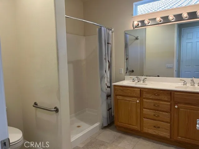 Primary Bathroom has Double-Sinks and Walk-in Shower