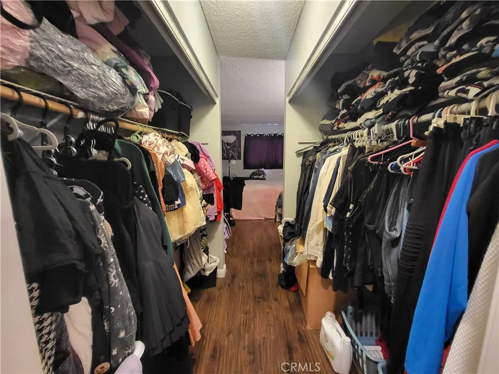 Bedroom closet is a hallway to the bathroom. Doors removed.