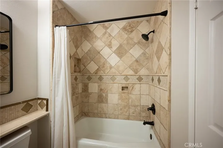 Upgraded with travertine flooring.