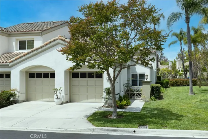 Additional highlights include a two-car garage with driveway, PEX repiping, and updated vinyl windows.