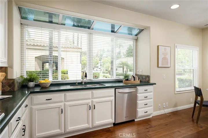 There are solarium windows in the kitchen that overlook a beautiful, expansive greenbelt.