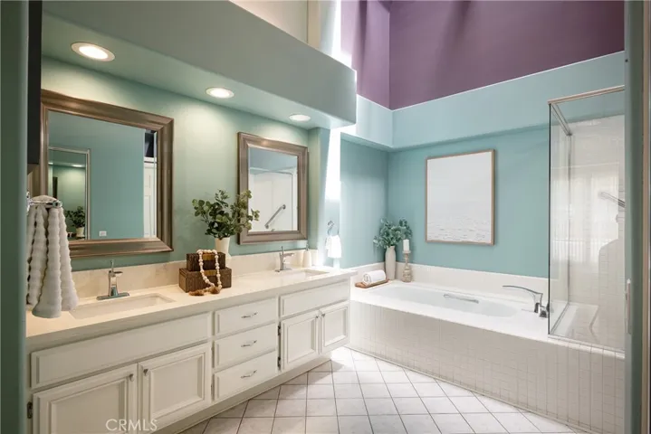 The primary bathroom includes a dual vanity with quartz countertops.