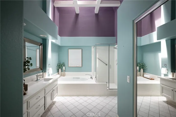 There is a skylight, soaking tub, and walk-in shower in the primary bathroom.