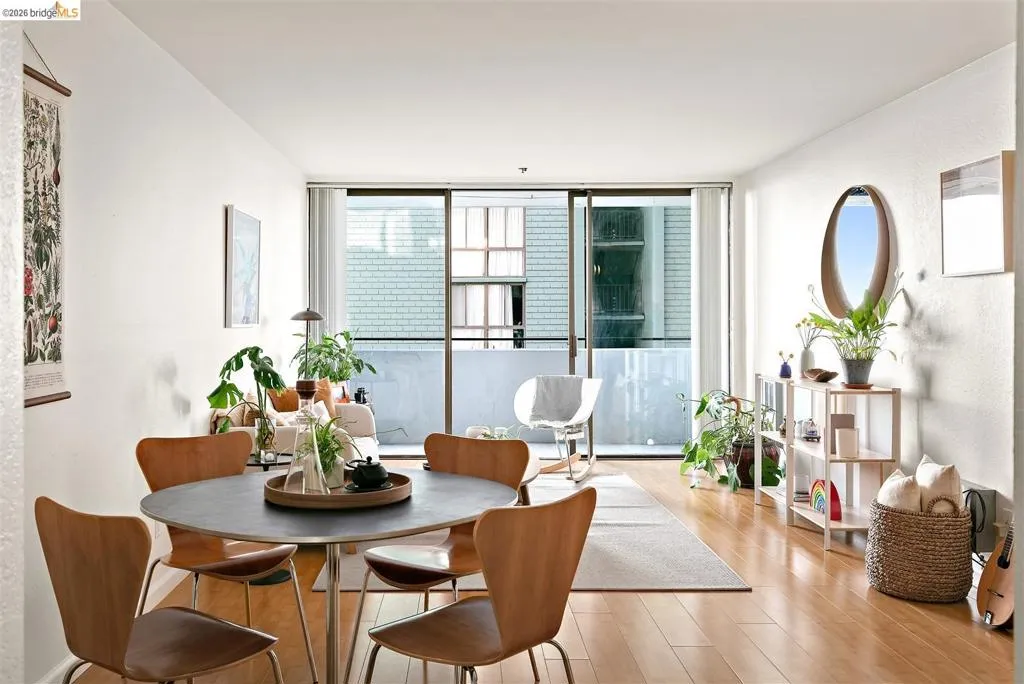 Bright living area with wood-finish flooring