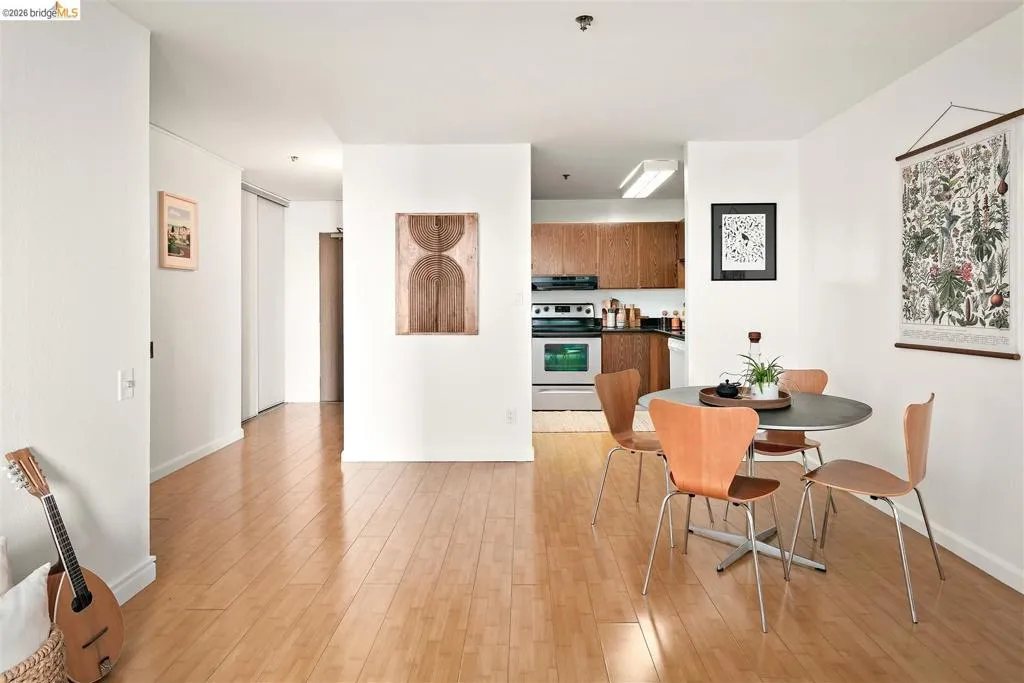 Open-concept living area featuring wood-finish flooring