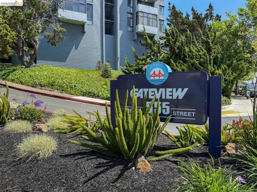 Gateview property signage with an architectural building facade in the background