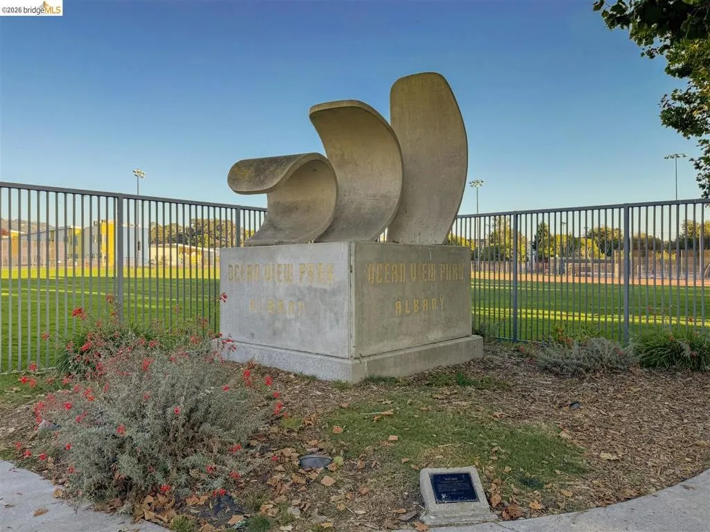 Sculptural monument with "Ocean View Park Albany" inscription, surrounded by manicured landscaping
