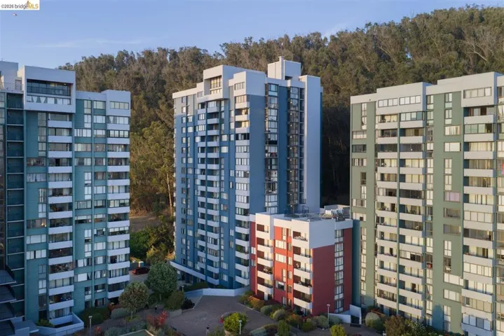 Contemporary high-rise buildings featuring multi-story facades, extensive window arrays, and individual balconies