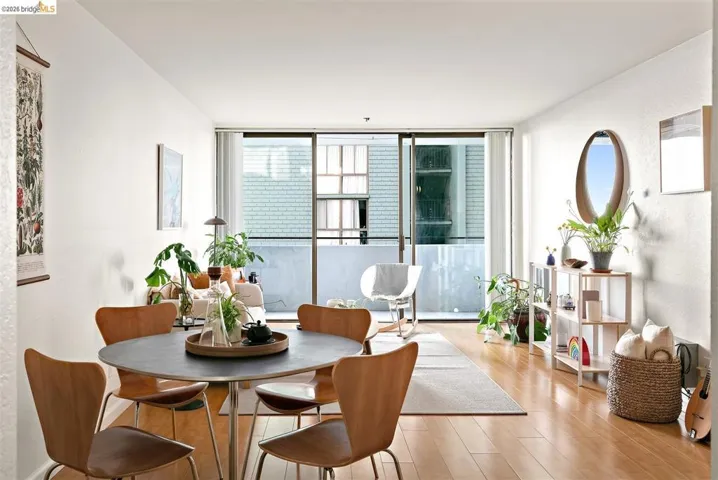 Bright living area with wood-finish flooring