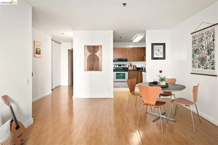 Open-concept living area featuring wood-finish flooring