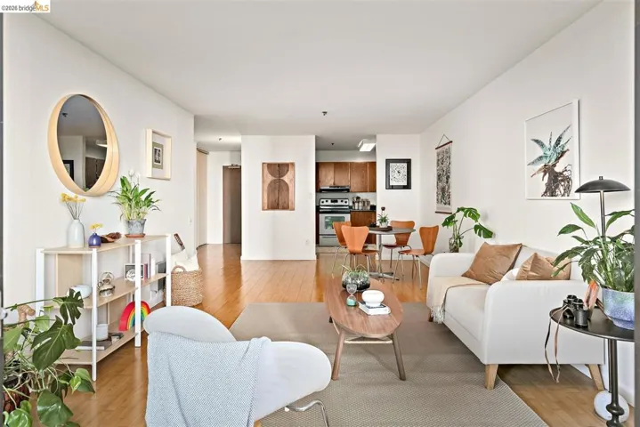 Open-concept living space featuring wood-finish flooring