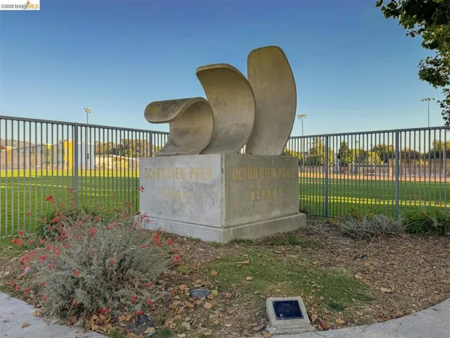Sculptural monument with "Ocean View Park Albany" inscription, surrounded by manicured landscaping