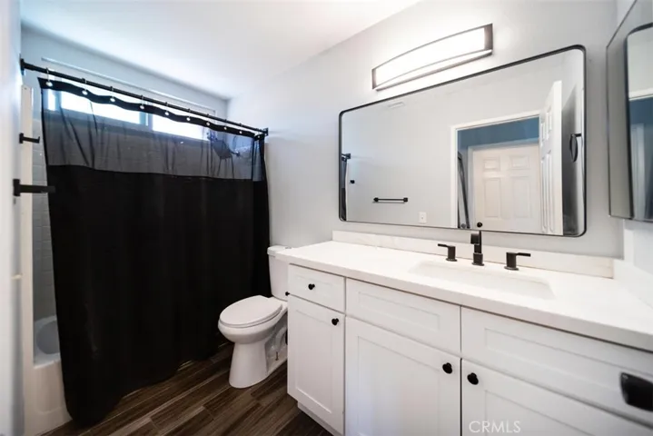 Upstairs guest bathroom with LVP floors and upgraded counters and fixtures