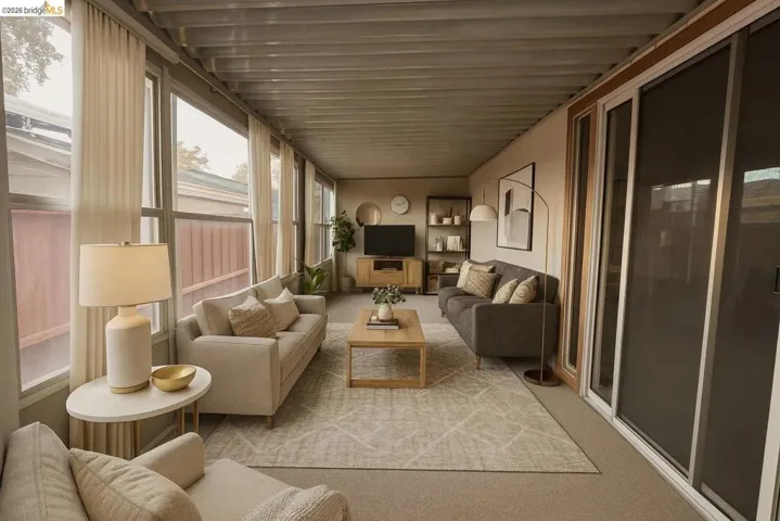 Sunroom featuring carpet floors