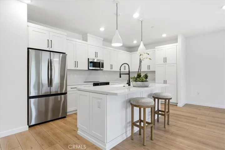 Designer Kitchen with appliances & pendant Lighting