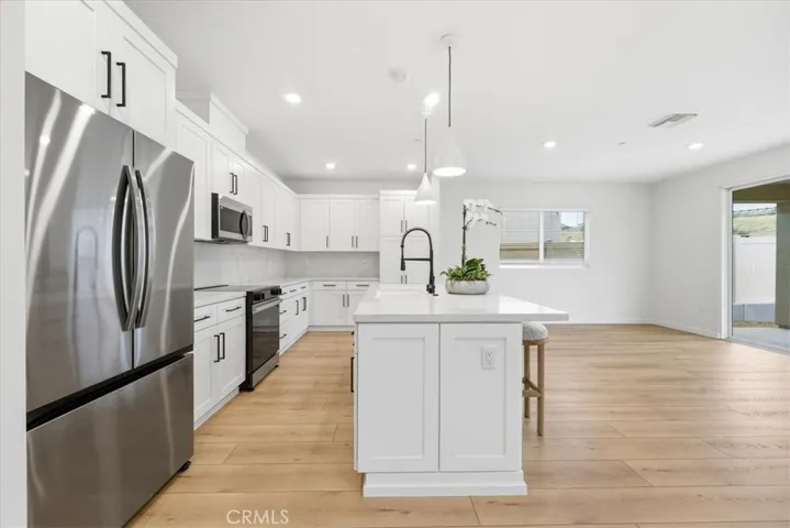 Designer Kitchen with appliances & pendant Lighting