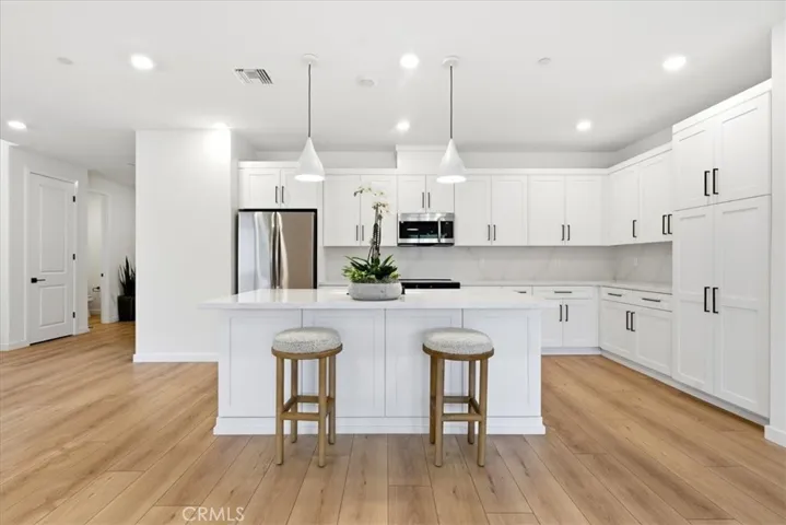 Designer Kitchen with appliances & pendant Lighting