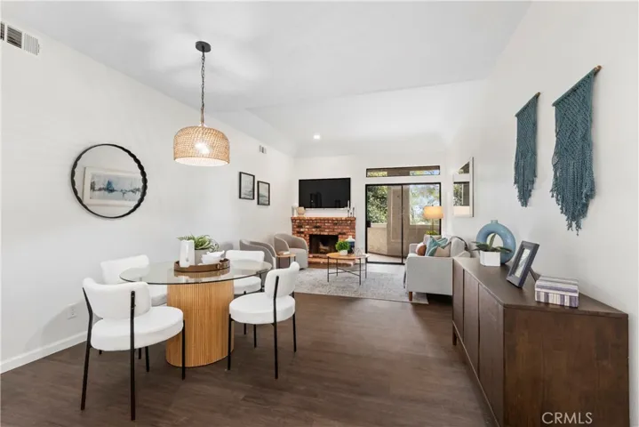 Open floorplan vinyl flooring, fireplace