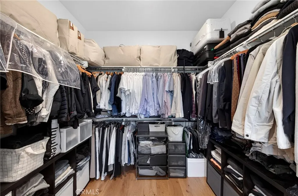 Primary bedroom walk in closet