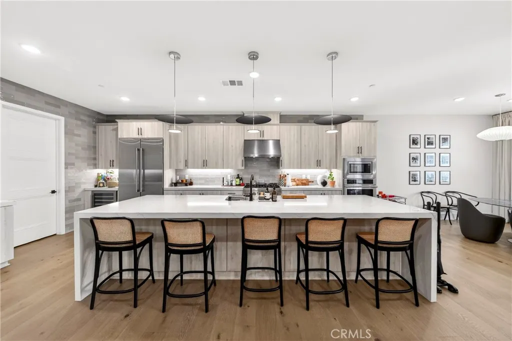 View of kitchen and dining area from family room