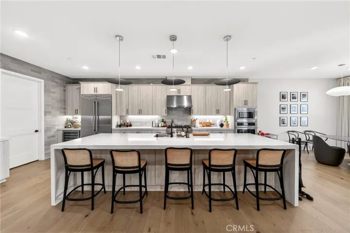 View of kitchen and dining area from family room