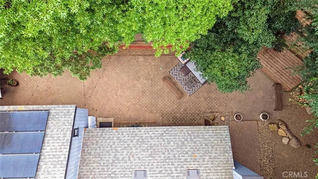 Entertainer's Delight! Enjoy an expansive, low-maintenance backyard featuring a partially elevated design with a retaining wall, creating a private and serene retreat perfect for relaxing or entertaining.