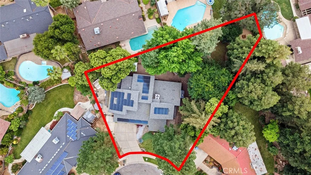 Designed for both entertaining and relaxation, the large, low-maintenance backyard showcases mature trees, a private atmosphere, and inviting spaces to gather with family and friends or enjoy a quiet escape.