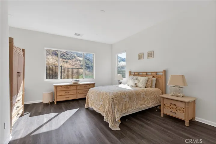 large primary bedroom with amazing views