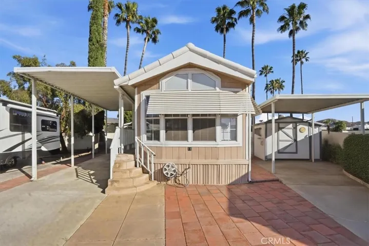 Front picture showing carport on left hand side.