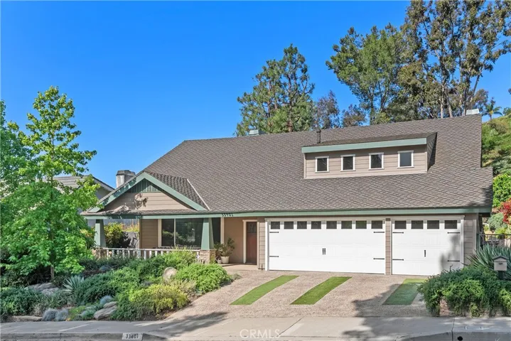 3 car garage. Plenty of driveway parking. Low maintenance vegetation.