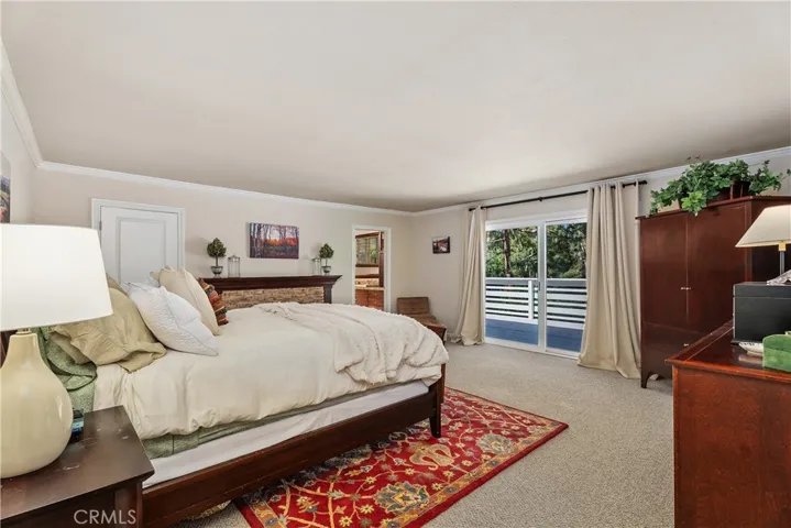 Views, privacy & large balcony off primary bedroom.