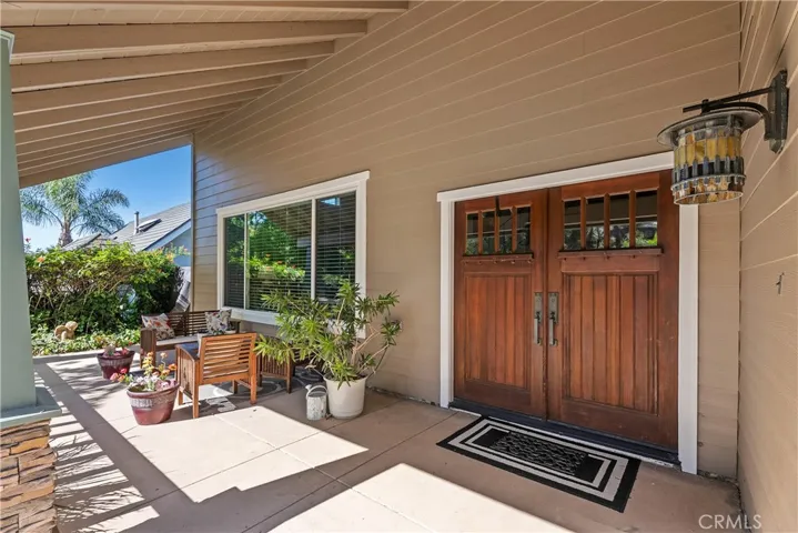 Covered front porch. Double door entry.
