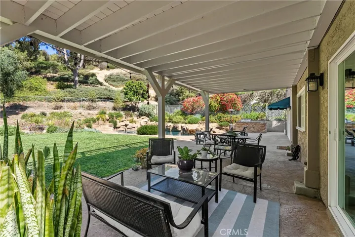Conveniently located large covered patio off kitchen & bonus/dining room in back.