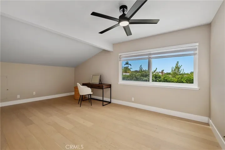 VERY LARGE SECONDARY BEDROOM. LIGHT AND BRIGHT, WOOD FLOORING, NEW BLINDS, AND DESIGNER CEILING FAN.