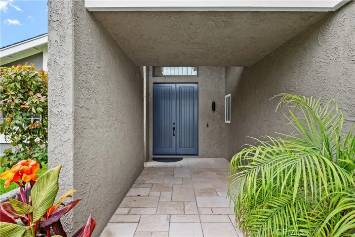 Great curb appeal with an inviting large entry way toward the home.