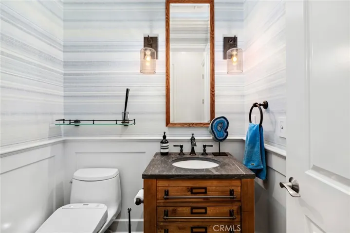 Downstairs powder room with mood lighting.