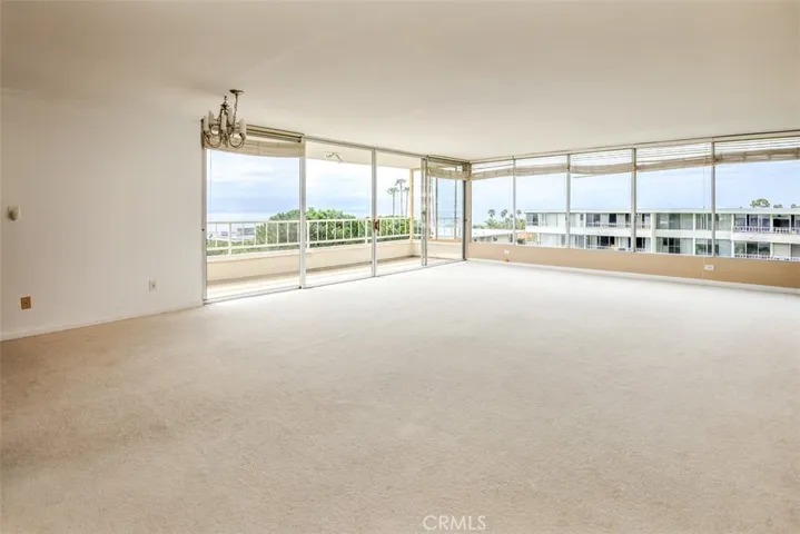 Oversized living room with access to two balconies