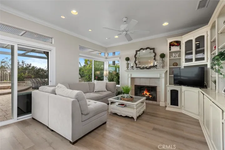 Family Room. Fire in fireplace is AI generated.