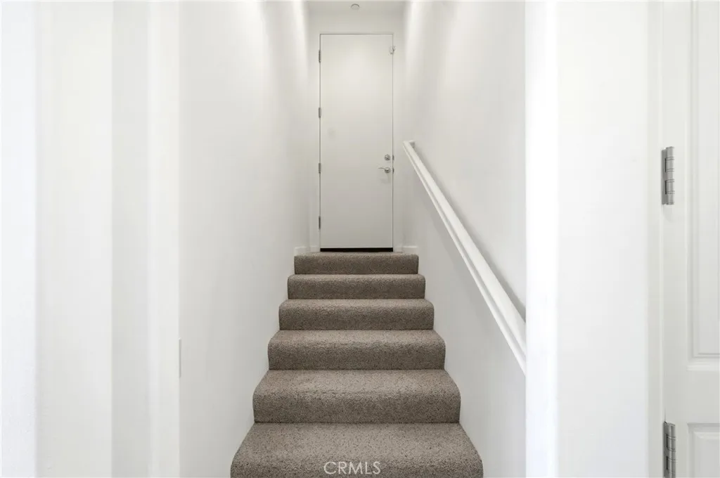 Stairs leading to the 2 car Garage