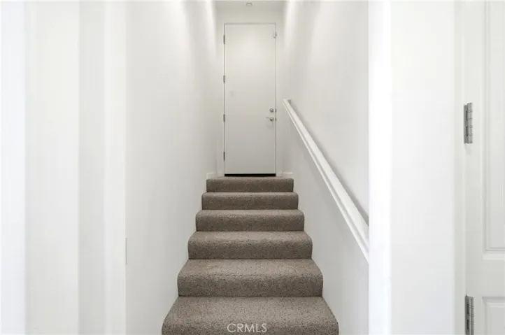 Stairs leading to the 2 car Garage