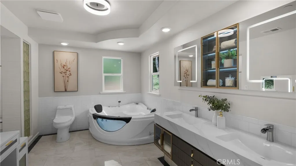 Primary bathroom features soaking tub and separate shower, lots of storage..