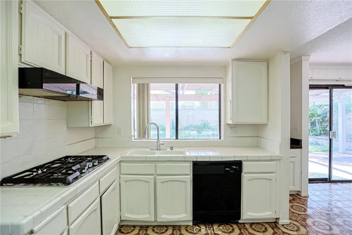 Neat kitchen with window.
